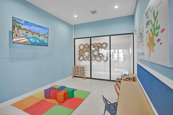 a view of a bedroom with furniture