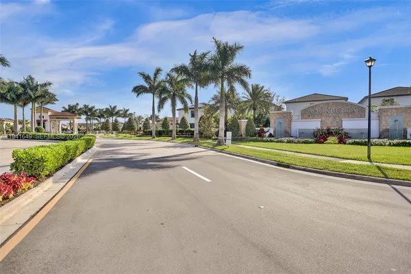 a view of a house with outdoor space and palm trees