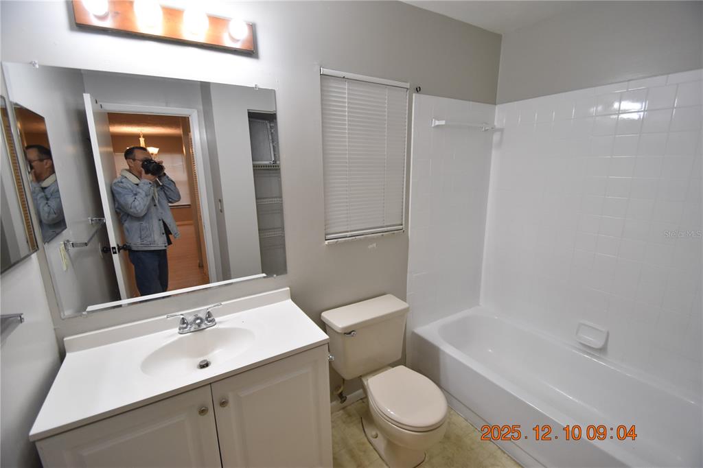 5824 Grey Street New Port Richey, FL 34652 - Photo 25 of 28 a bathroom with a sink a toilet and shower