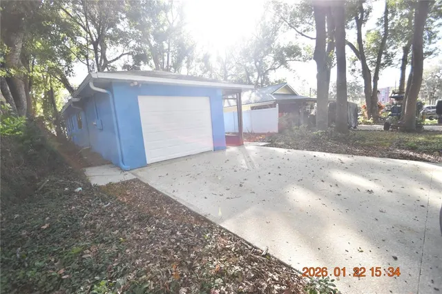 a view of backyard with large trees