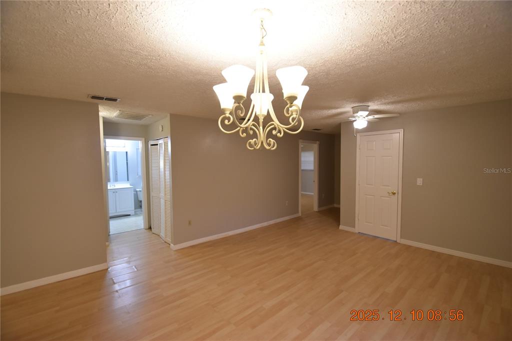 5824 Grey Street New Port Richey, FL 34652 - Photo 4 of 28 a view of an empty room with wooden floor