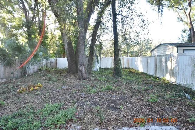 a backyard of a house with lots of green space