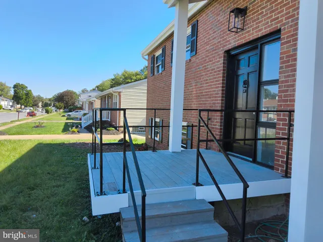 a kitchen with stainless steel appliances a stove a microwave a sink and cabinets