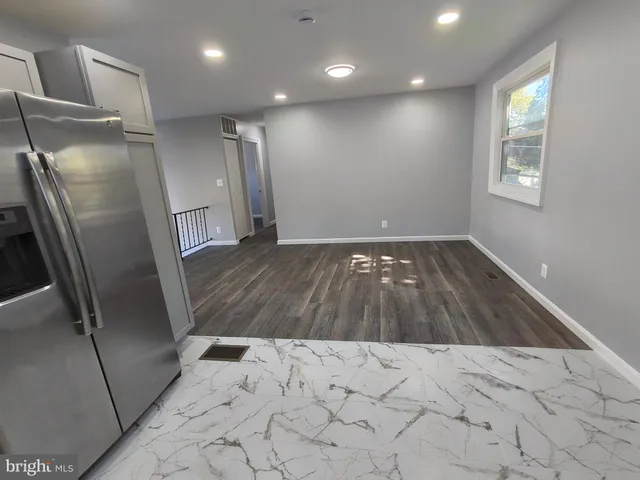 a bathroom with a sink toilet and window