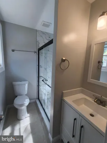 a view of a livingroom with wooden floor