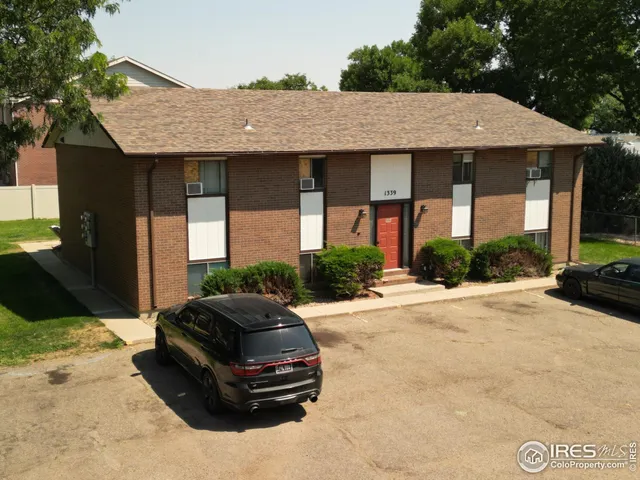 a car parked in front of a house