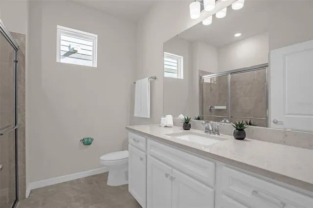 a bathroom with a sink and a shower