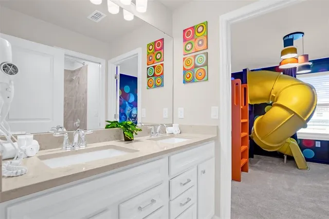 a bedroom with a bed and a lamp