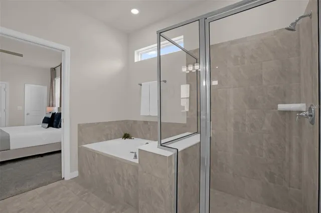 a bedroom with bed and window