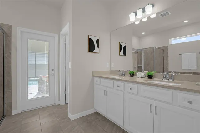 a bedroom with a bed and a walk in closet