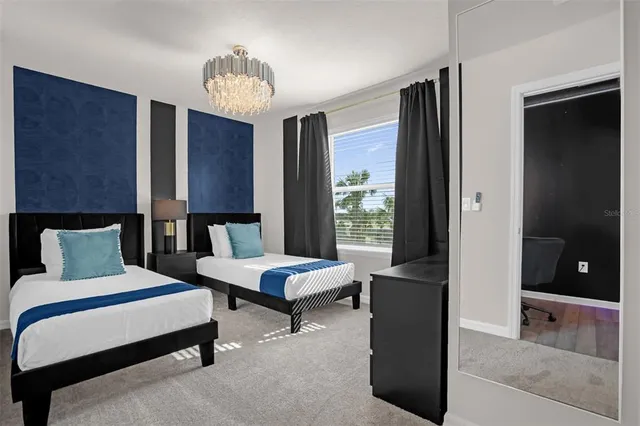 a outdoor space with lots of tables a mirror and couches