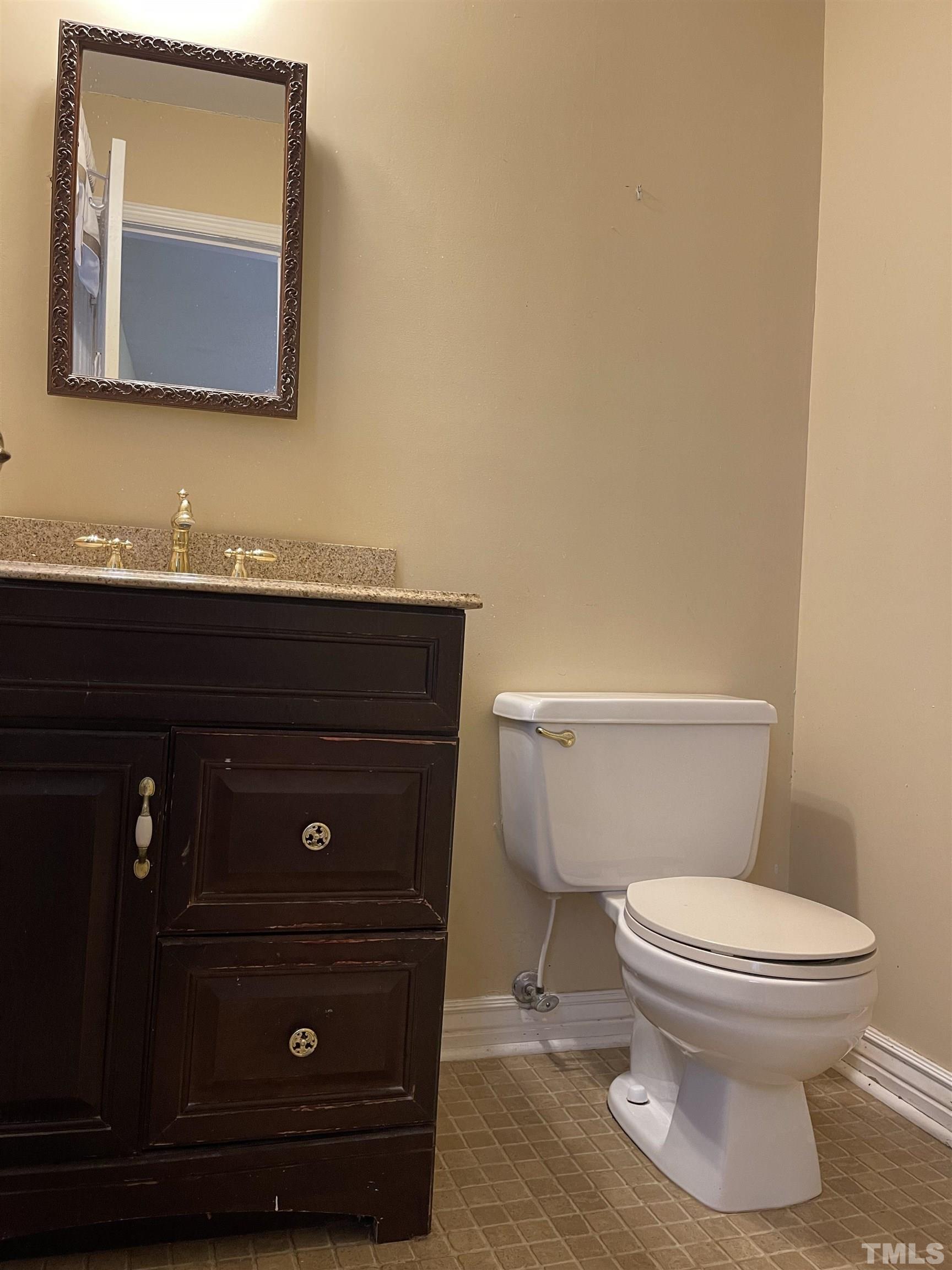 1429 Clermont Road Durham, NC 27713 - Photo 5 of 10 a bathroom with a toilet and a sink