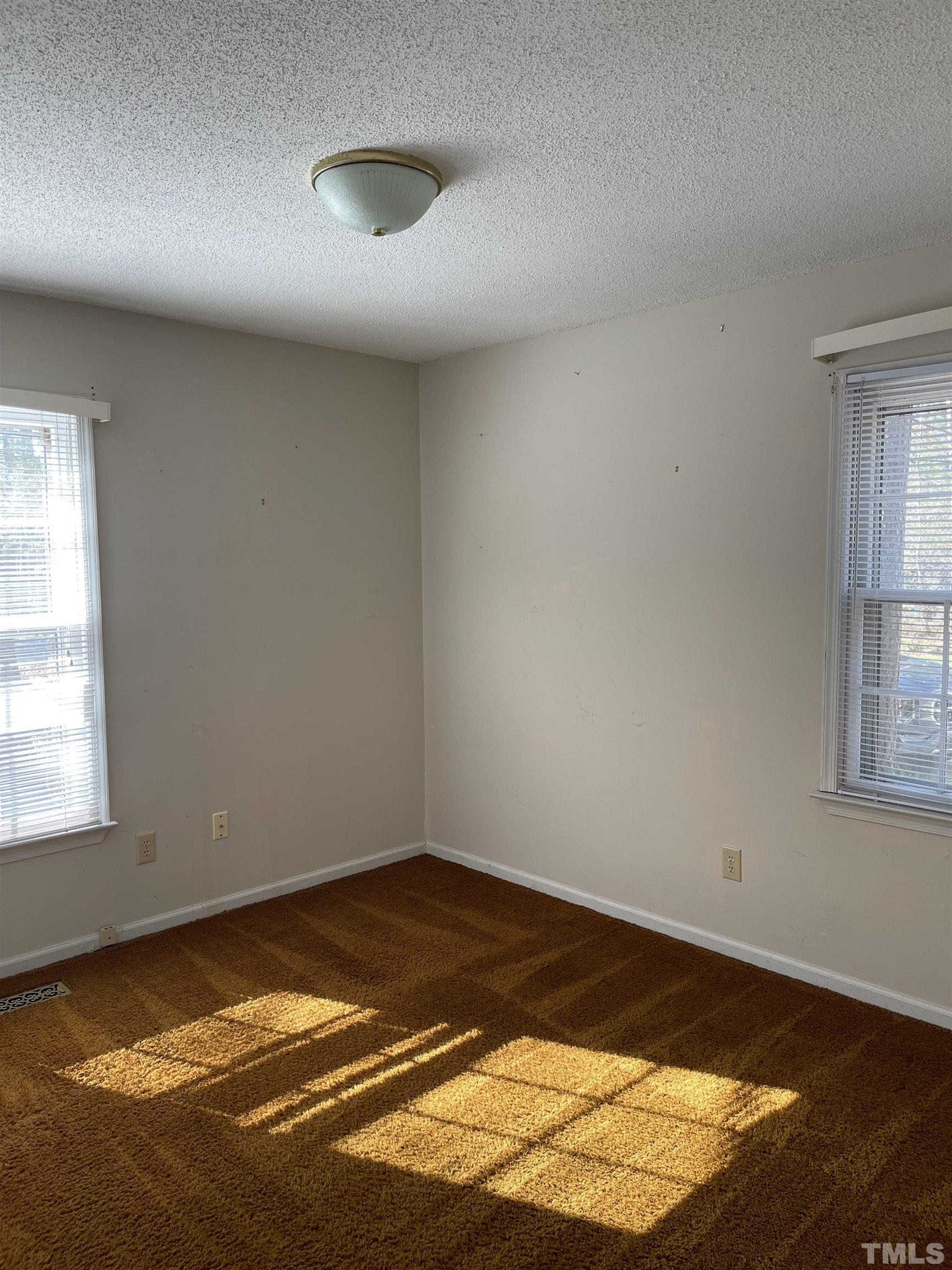 1429 Clermont Road Durham, NC 27713 - Photo 7 of 10 a view of a room with wooden floor and a window