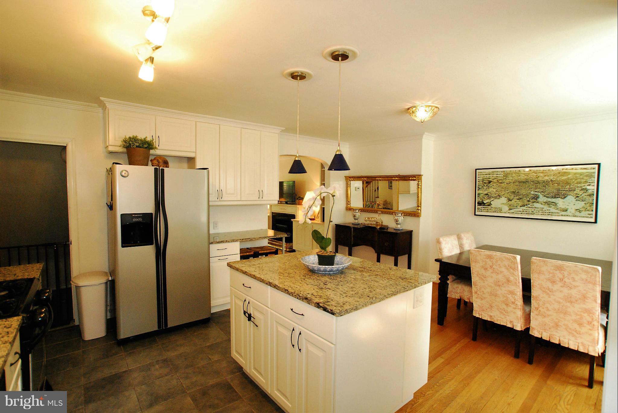 195 Stanmore Road Baltimore, MD 21212 - Photo 1 of 22 a kitchen with sink refrigerator and microwave