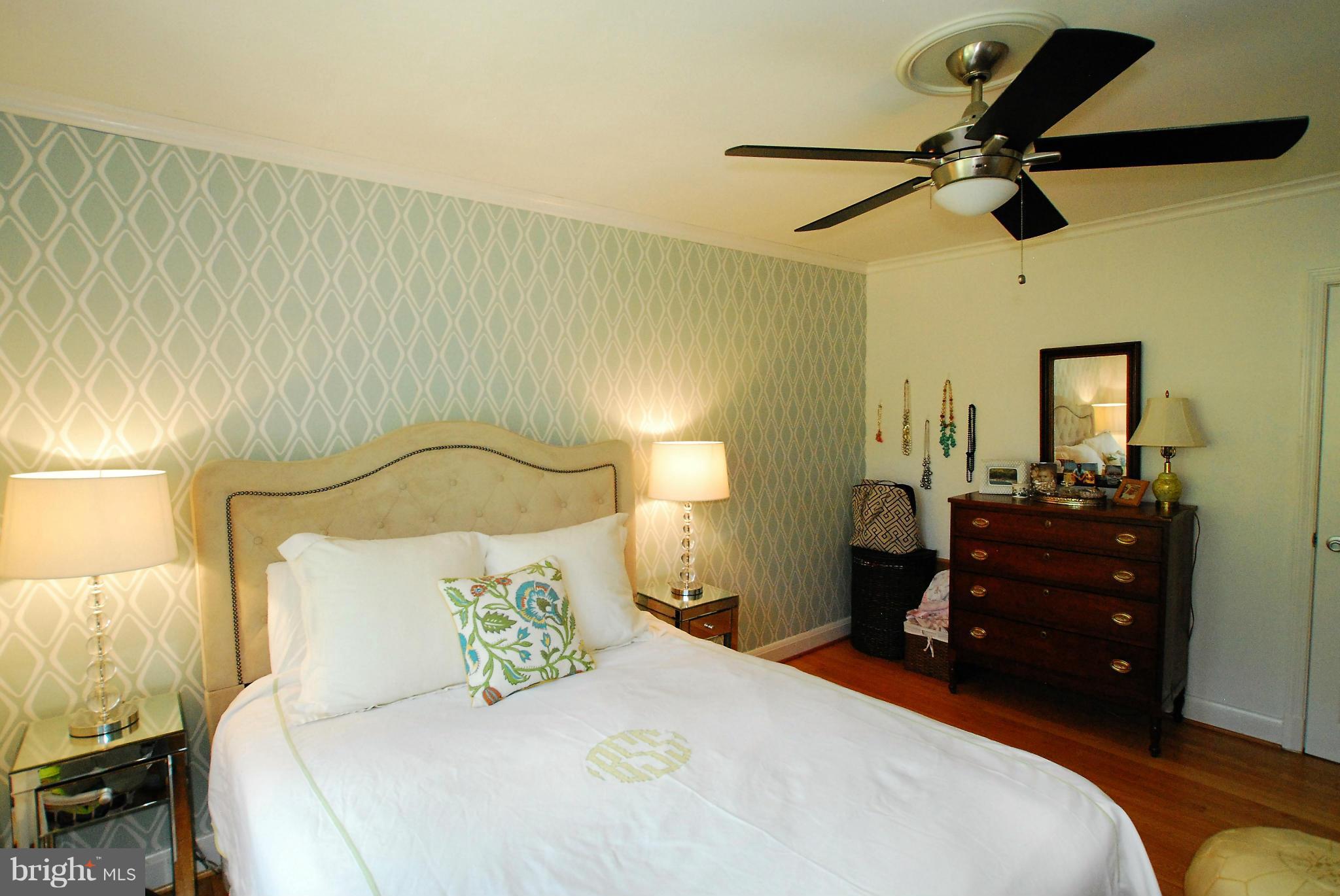 195 Stanmore Road Baltimore, MD 21212 - Photo 12 of 22 a bedroom with a bed and a chandelier