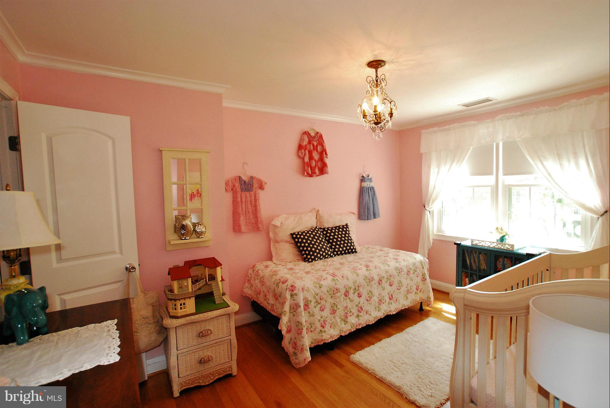 195 Stanmore Road Baltimore, MD 21212 - Photo 13 of 22 a bedroom with a bed and wooden floor