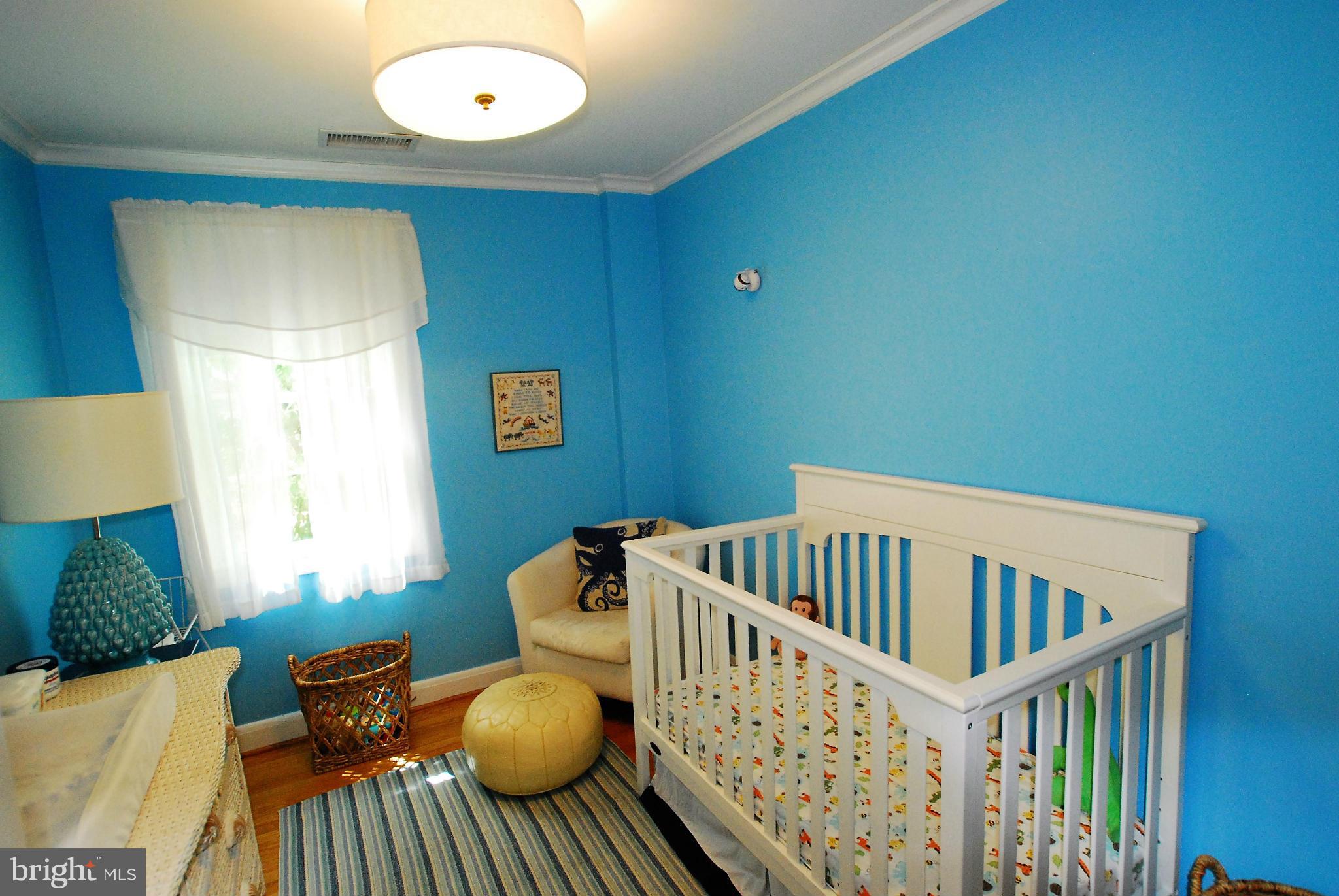 195 Stanmore Road Baltimore, MD 21212 - Photo 15 of 22 a bedroom with furniture and a window