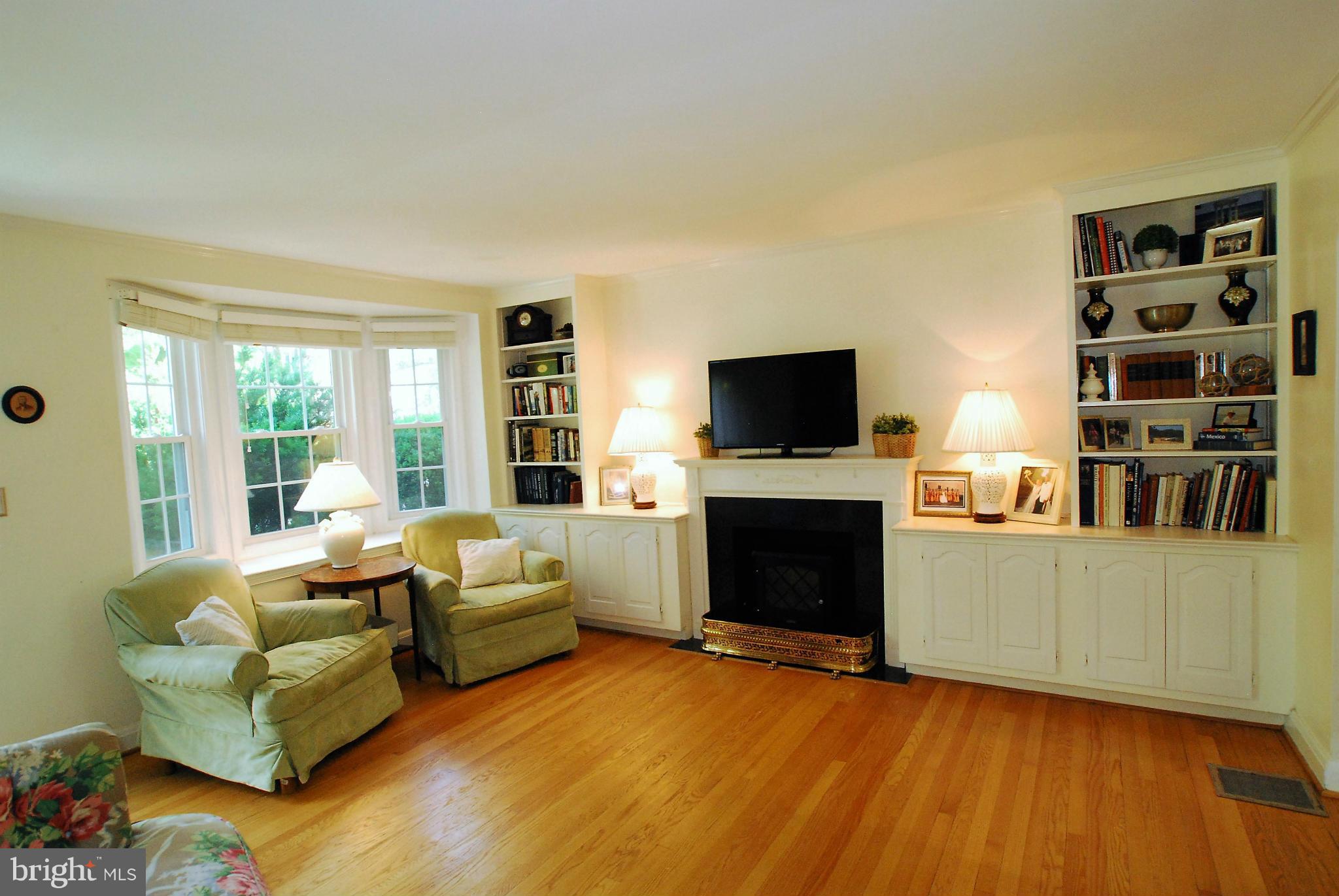 195 Stanmore Road Baltimore, MD 21212 - Photo 5 of 22 a living room with furniture a flat screen tv and a fireplace