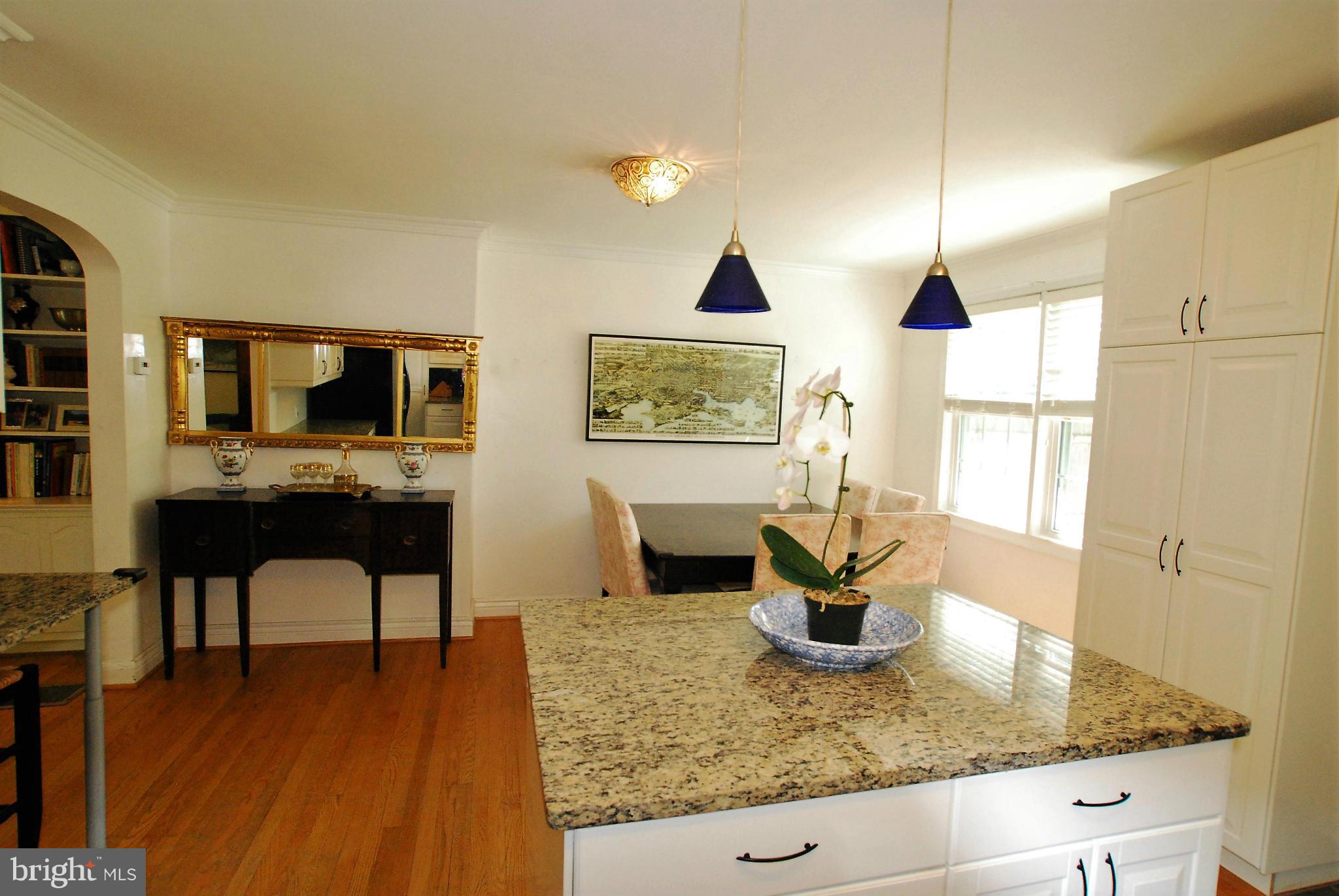 195 Stanmore Road Baltimore, MD 21212 - Photo 10 of 22 a view of a kitchen with kitchen island a counter top space a sink stainless steel appliances and cabinets