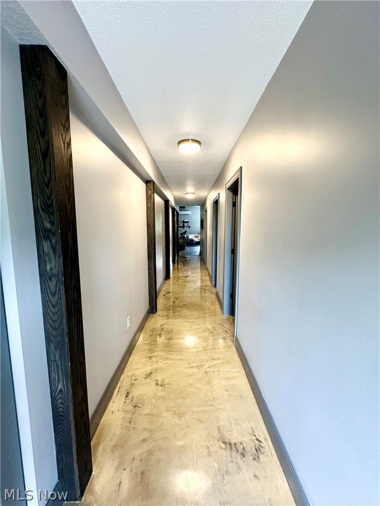148 Rural Lane Chester, WV 26034 - Photo 16 of 32 Hallway featuring epoxy flooring