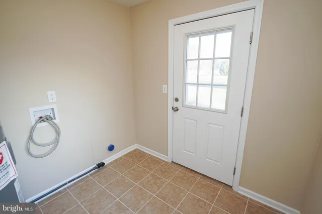 a view of an empty room and closet area