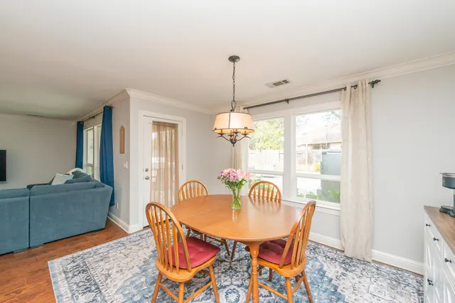 a bathroom with a granite countertop sink a mirror and a bathtub