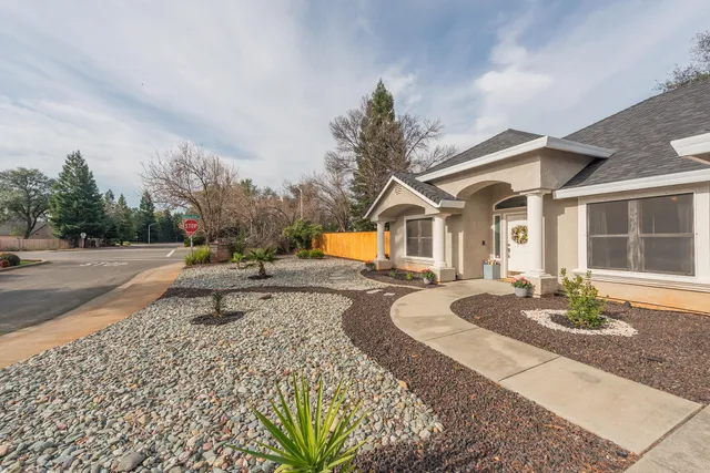 a spacious bedroom with a bed and wooden floor