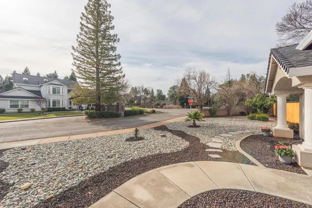 a living room with furniture a flat screen tv and a window