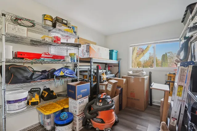 a bathroom with a toilet sink and curtain