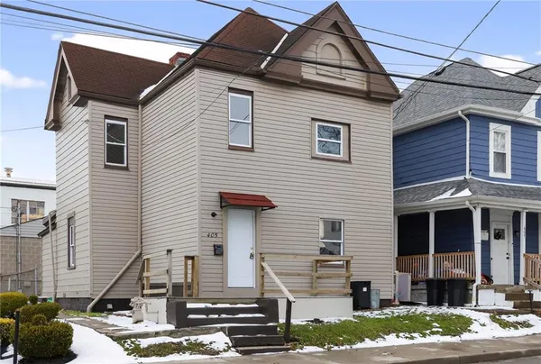a front view of a house with garage