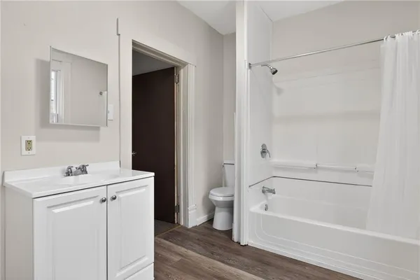 a bathroom with a sink toilet and vanity