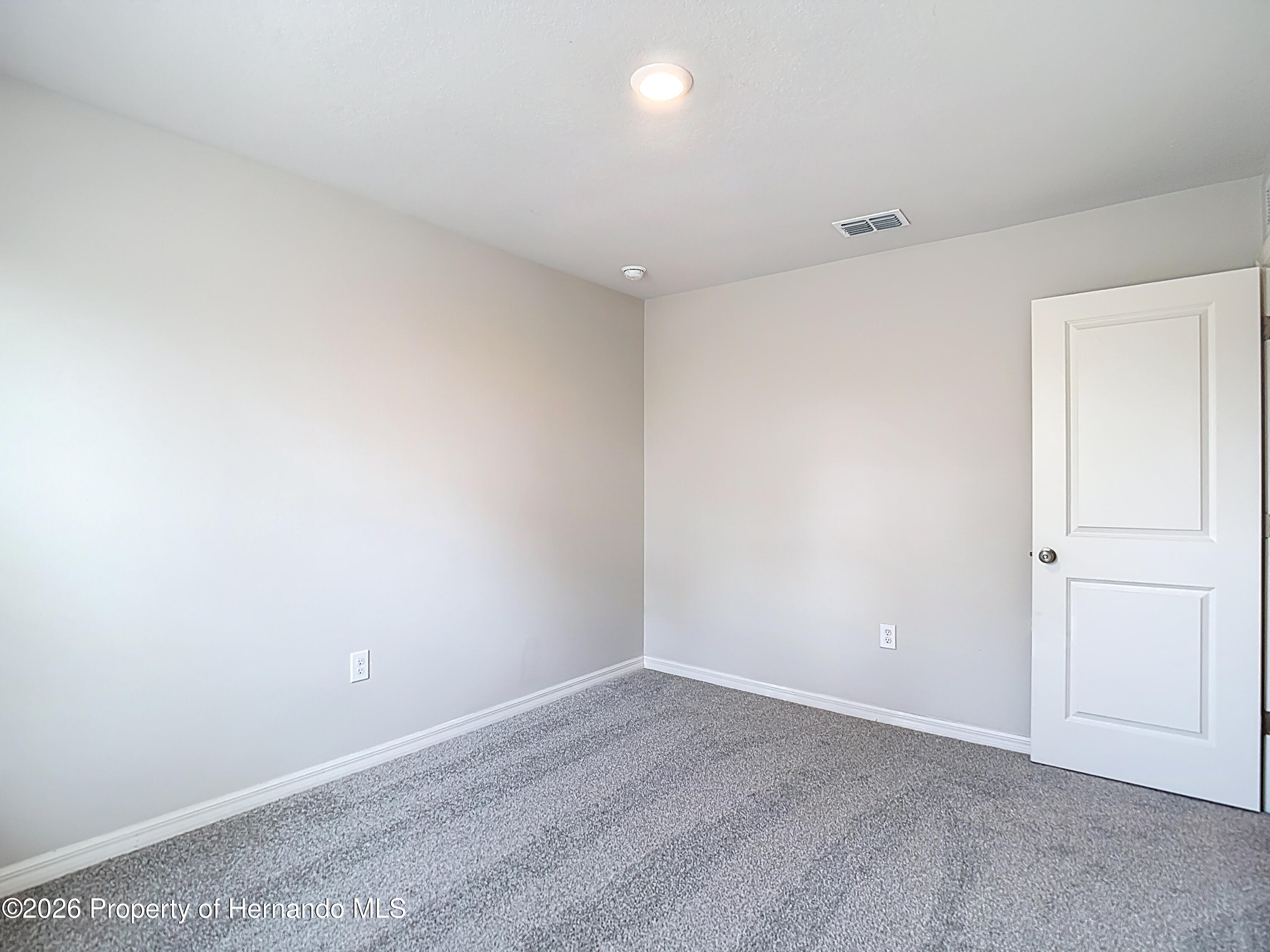 11374 Marcella Avenue Weeki Wachee, FL 34614 - Photo 52 of 70 a view of an empty room