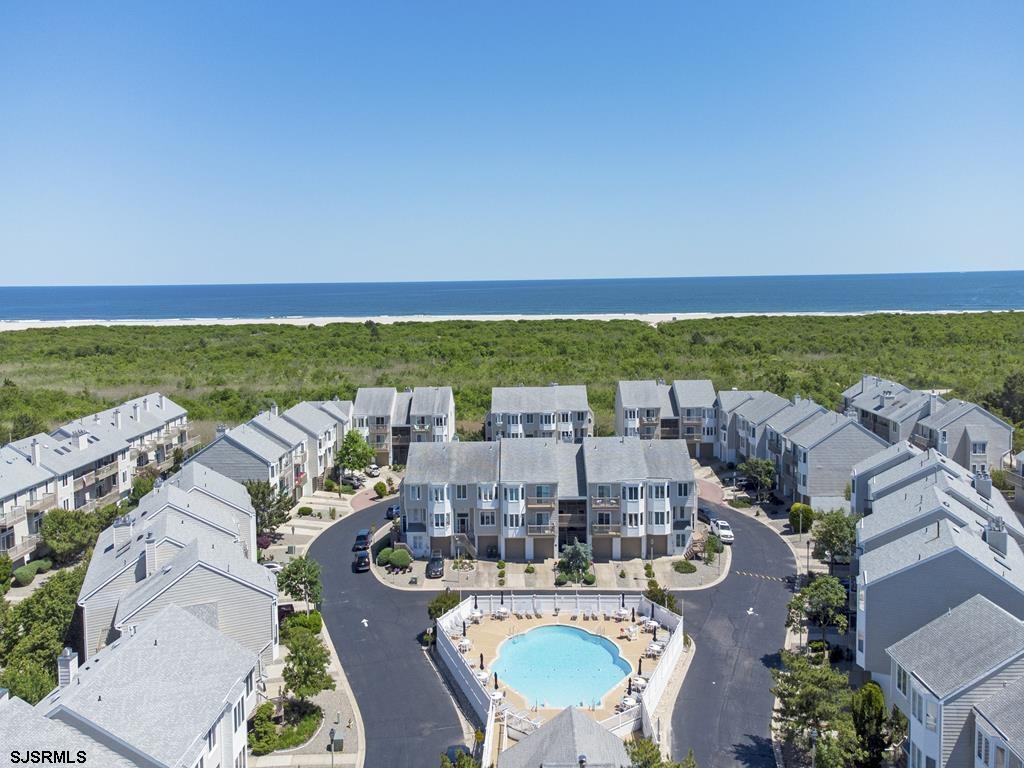 an aerial view of a house with outdoor space