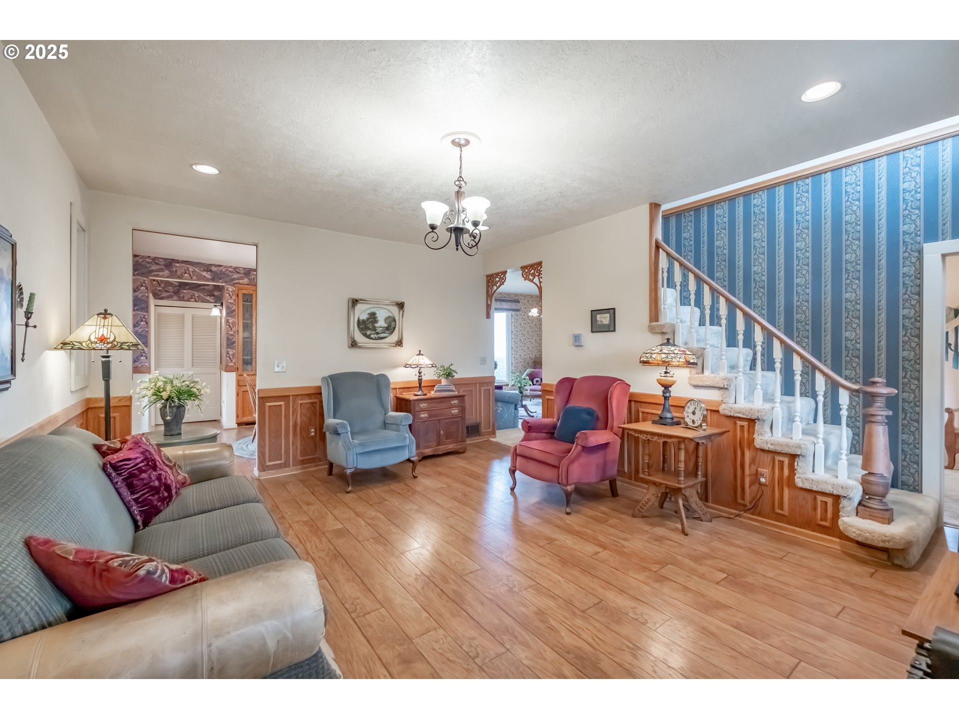 39986 Gisler Road Scio, OR 97374 - Photo 12 of 45 a living room with furniture a chandelier and a wooden floor