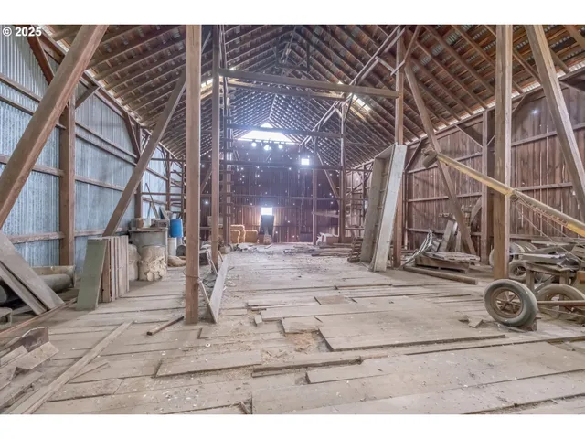 a view of an empty room with kitchen