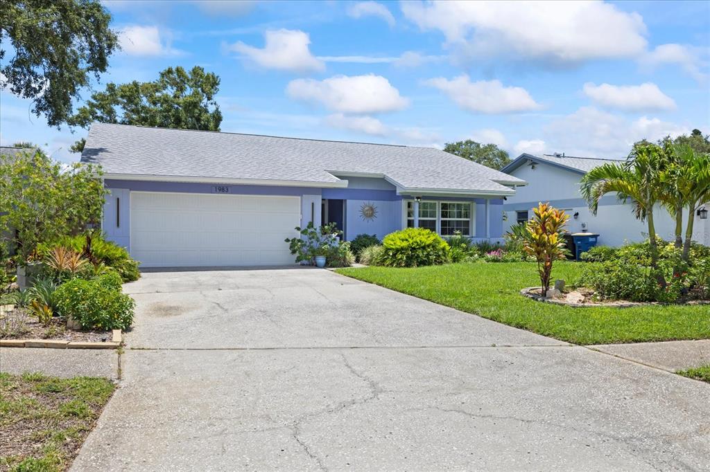 1983 Seton Drive Clearwater, FL 33763 - Photo 1 of 1 a front view of a house with a garden and plants