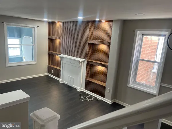 a kitchen with windows and refrigerator