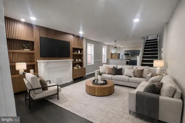 a living room with furniture and a flat screen tv
