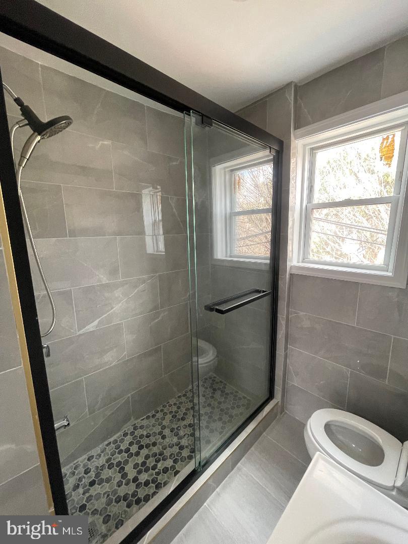 1119 Chestnut Street Darby, PA 19023 - Photo 18 of 37 a bathroom with a shower and toilet