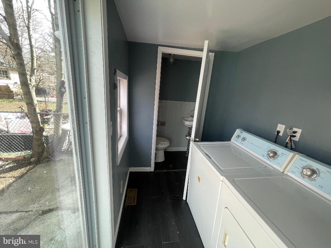 1119 Chestnut Street Darby, PA 19023 - Photo 21 of 37 a utility room with dryer and washer