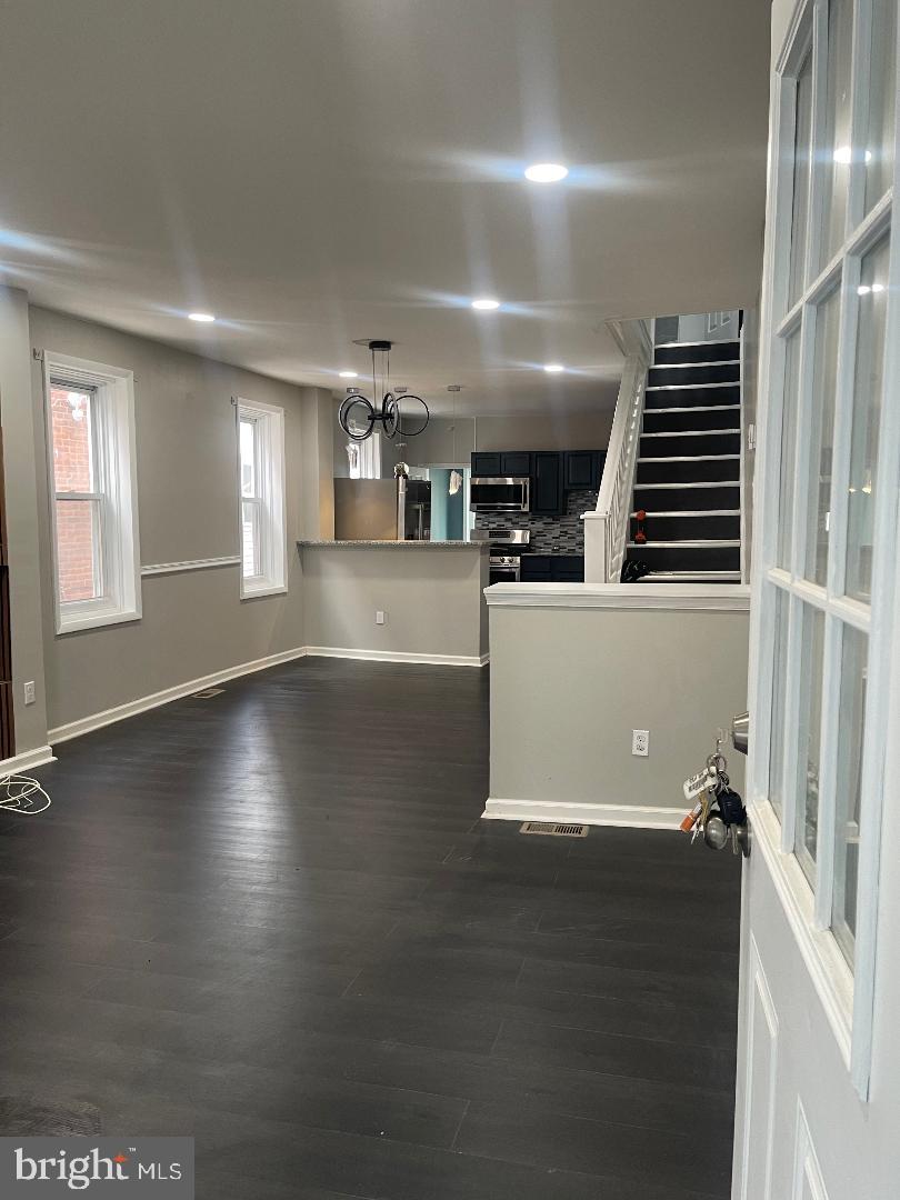 1119 Chestnut Street Darby, PA 19023 - Photo 23 of 37 an empty room with wooden floor and windows