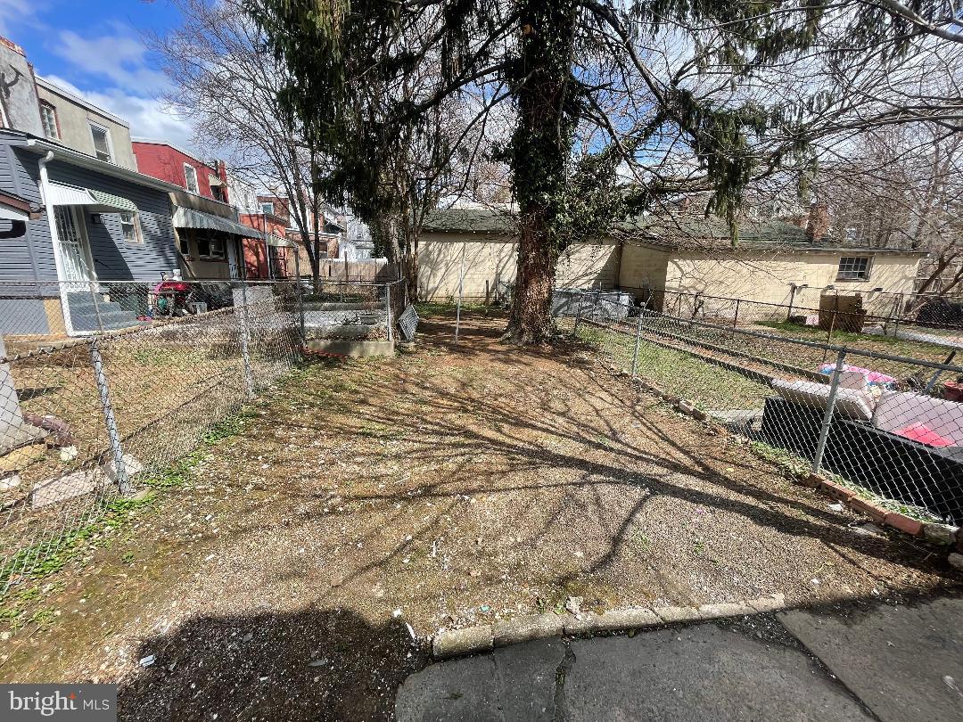1119 Chestnut Street Darby, PA 19023 - Photo 3 of 37 a view of a large yard with cars parked on the road