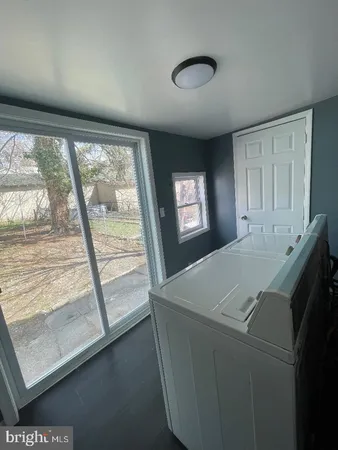 a view of kitchen with furniture and window