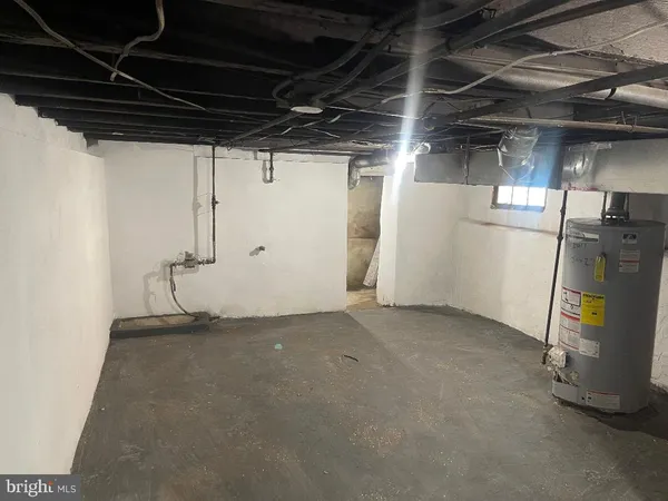 a view of a room with wooden shelves