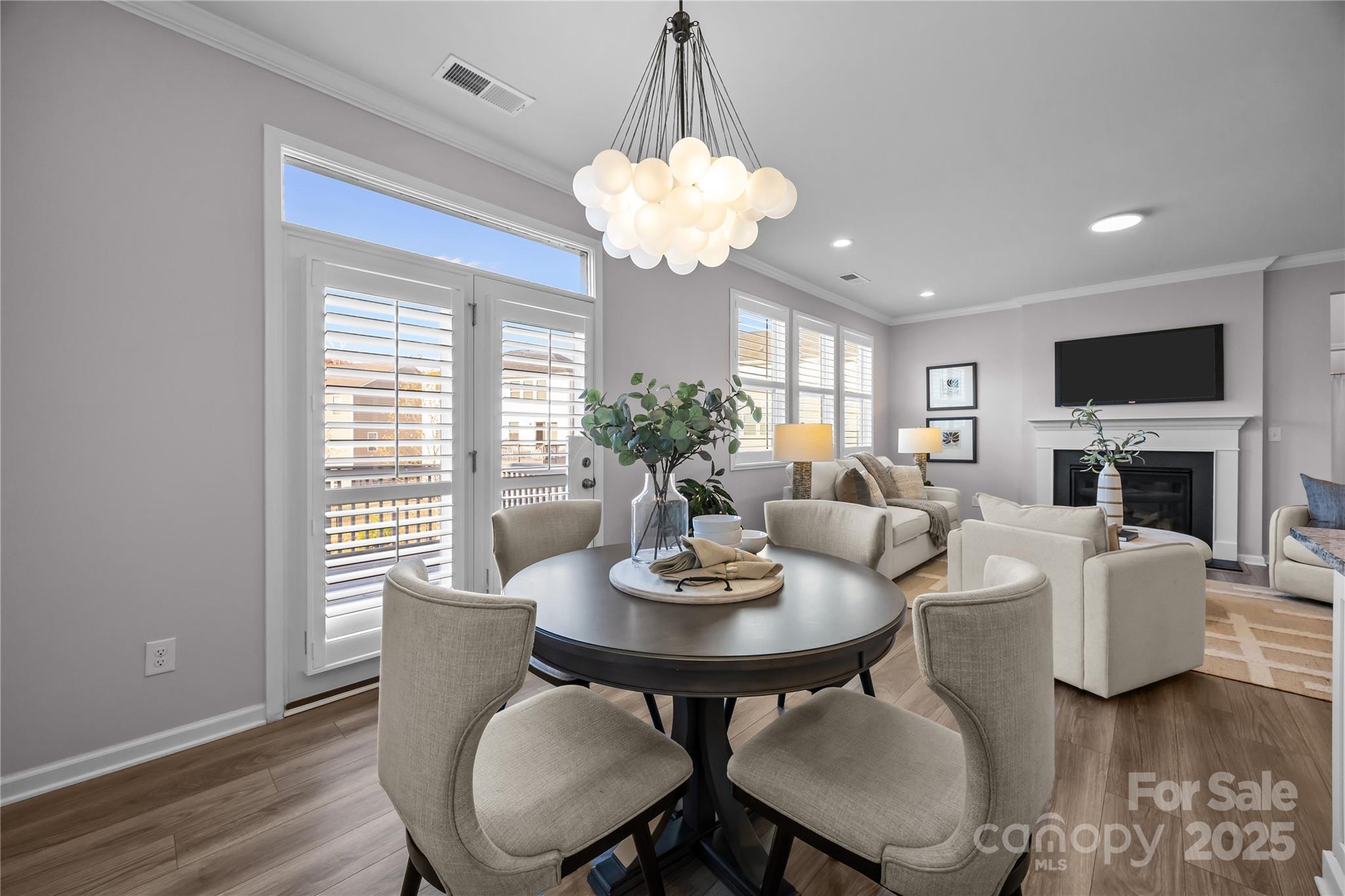 16124 Fieldstone Trace Charlotte, NC 28278 - Photo 11 of 45 a view of a dining room with furniture window and wooden floor