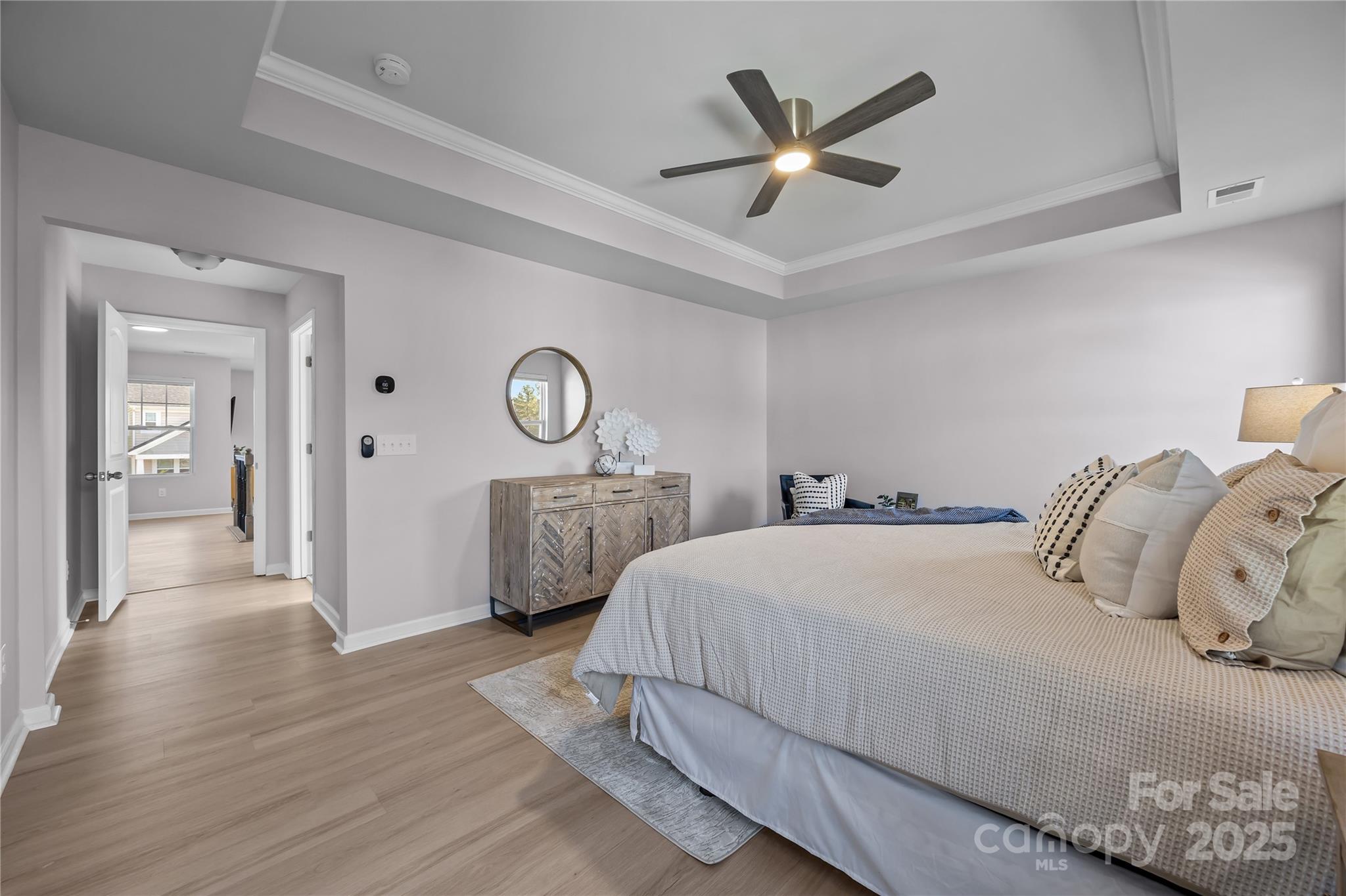 16124 Fieldstone Trace Charlotte, NC 28278 - Photo 21 of 45 a bedroom with a large bed and a chandelier