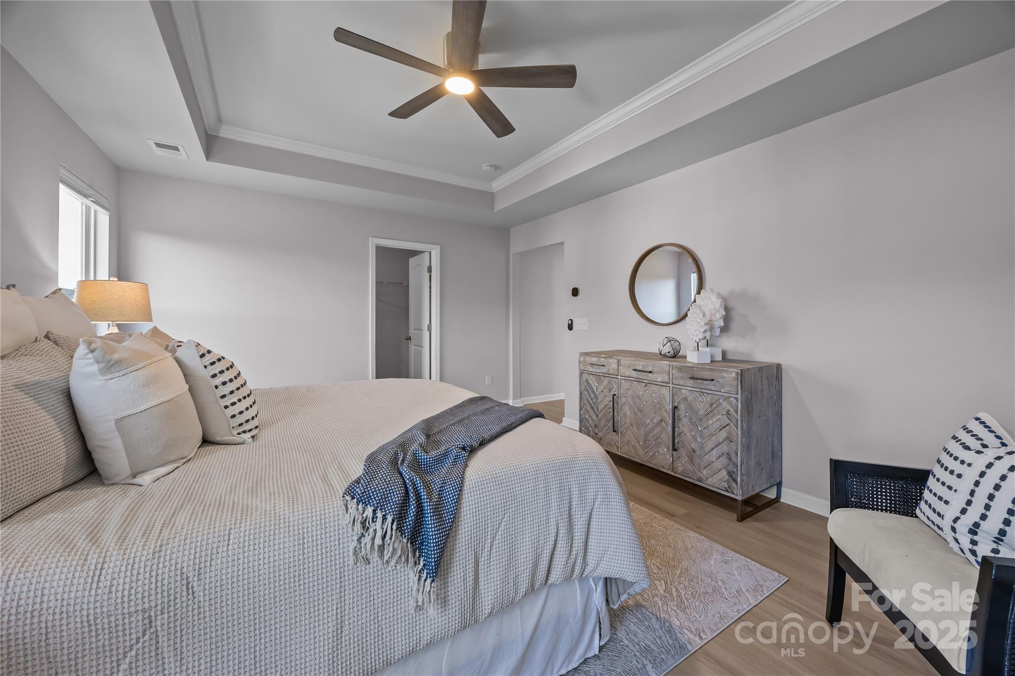 16124 Fieldstone Trace Charlotte, NC 28278 - Photo 22 of 45 a bedroom with bed and a chandelier