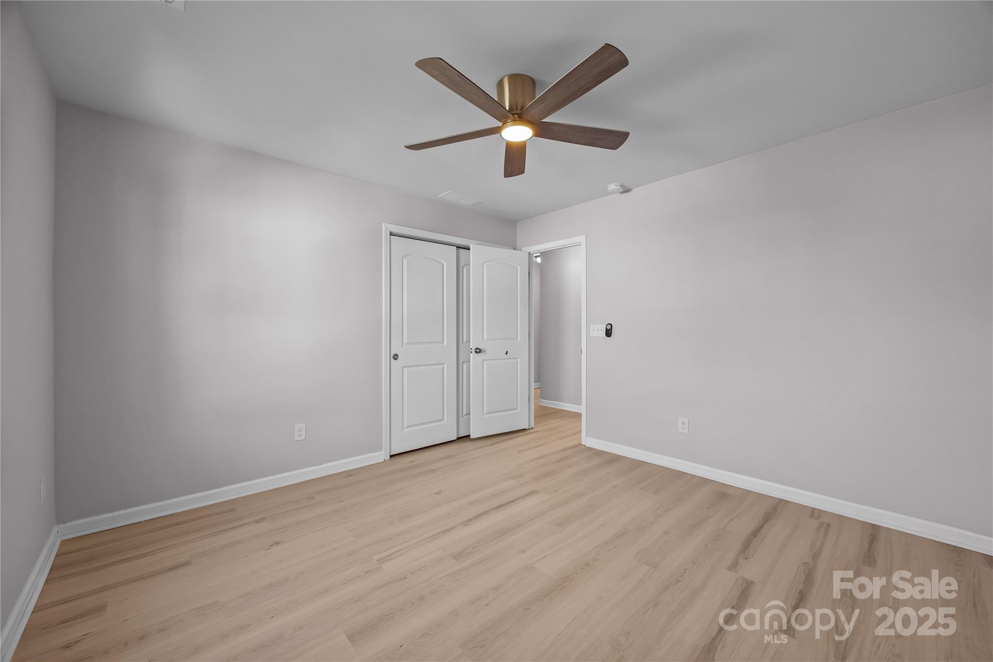 16124 Fieldstone Trace Charlotte, NC 28278 - Photo 28 of 45 a view of an empty room with wooden floor