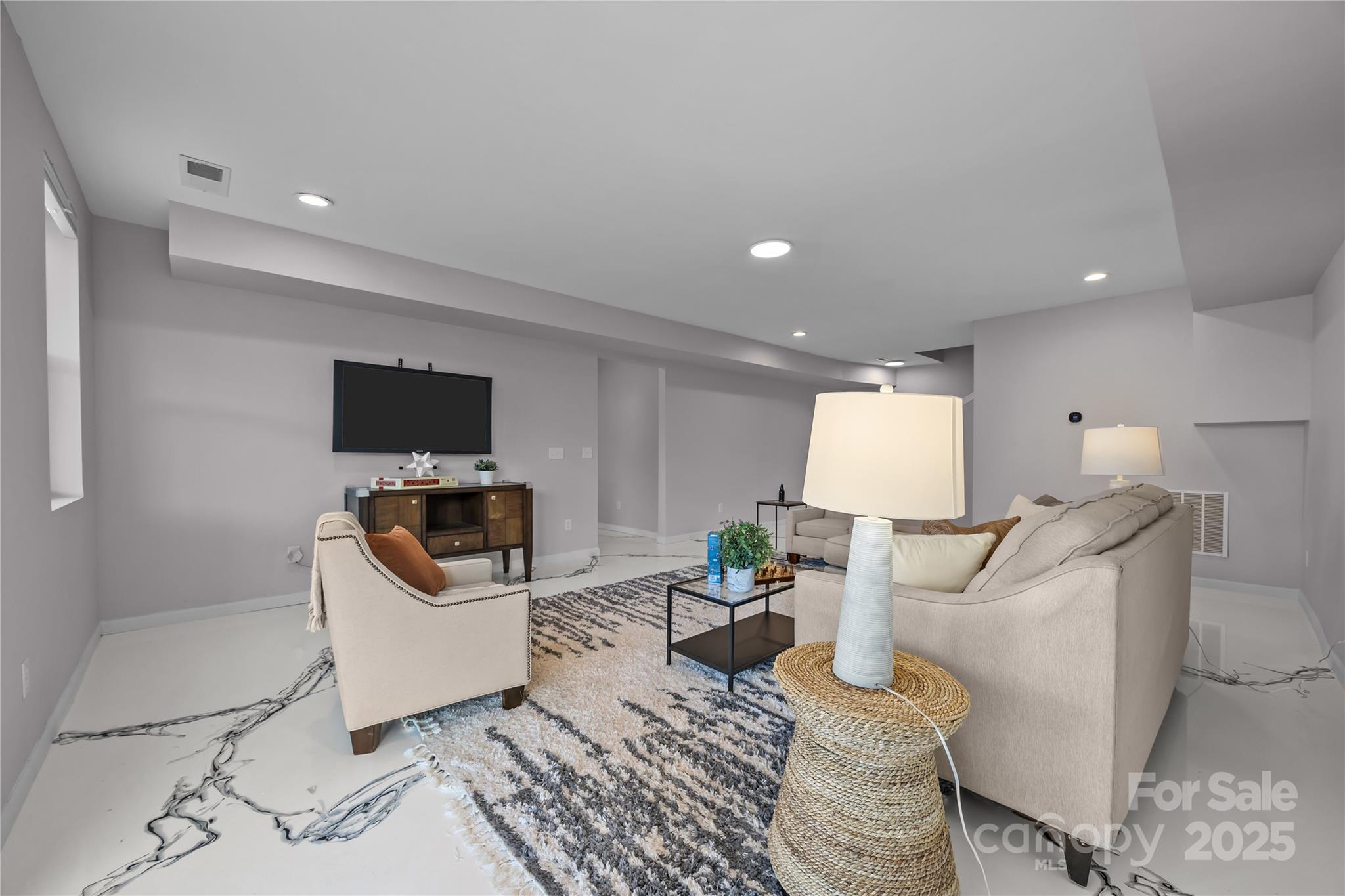 16124 Fieldstone Trace Charlotte, NC 28278 - Photo 35 of 45 a living room with furniture and a flat screen tv