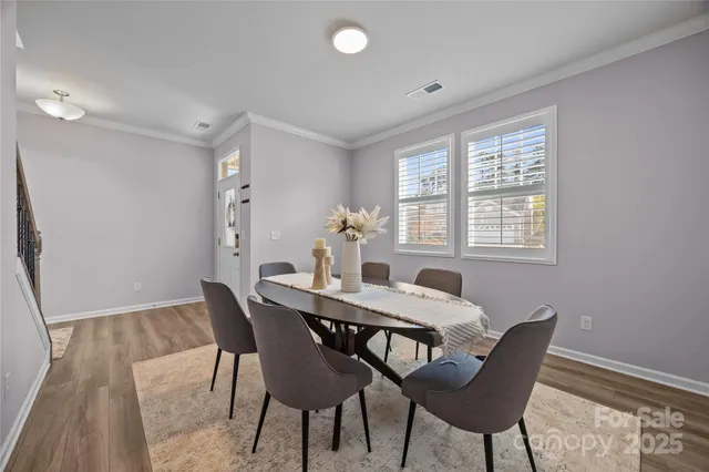 a large kitchen with lots of counter space a sink appliances and living room view